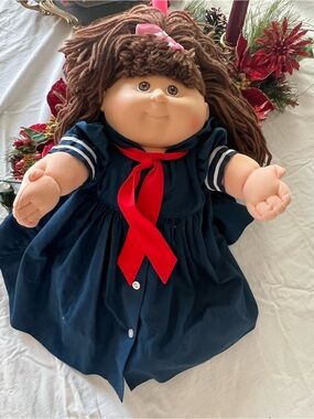 Plush Sailor-Style Girl Doll in Navy Dress with Red Ribbon